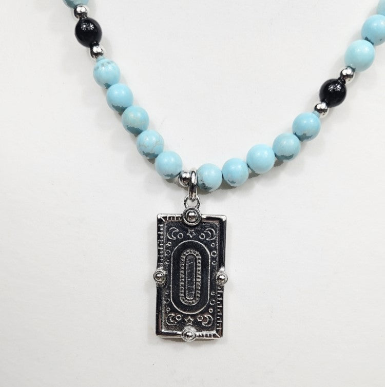 Silver Enamel Snake Dog Tag pendant on a Turquoise necklace